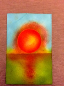 Add some sponged darker orange to the sun